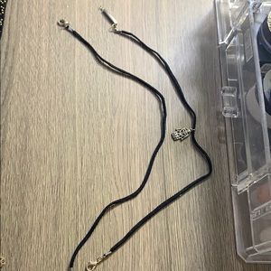 2 think black chockers one with hand